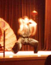 [Shang Yu, performing Nan Quan]